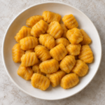 Ñoquis de calabaza cocidos y escurridos, sin salsa.